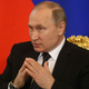 Vladimir Putin, finger-tenting in the manner of carton villains everywhere. (Photo: Mikhail Svetlov/Getty)